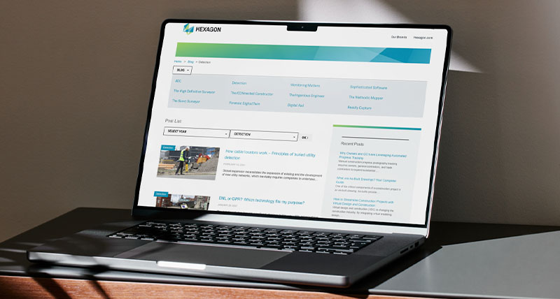 A laptop showing utility detection Hexagon blog posts